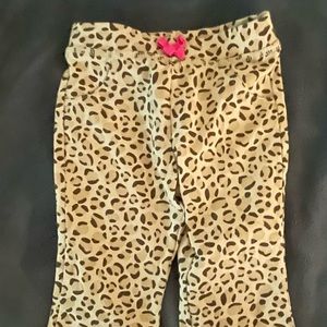 Brown leopard toddler leggings with tiny pink bow at top  in size 12 months